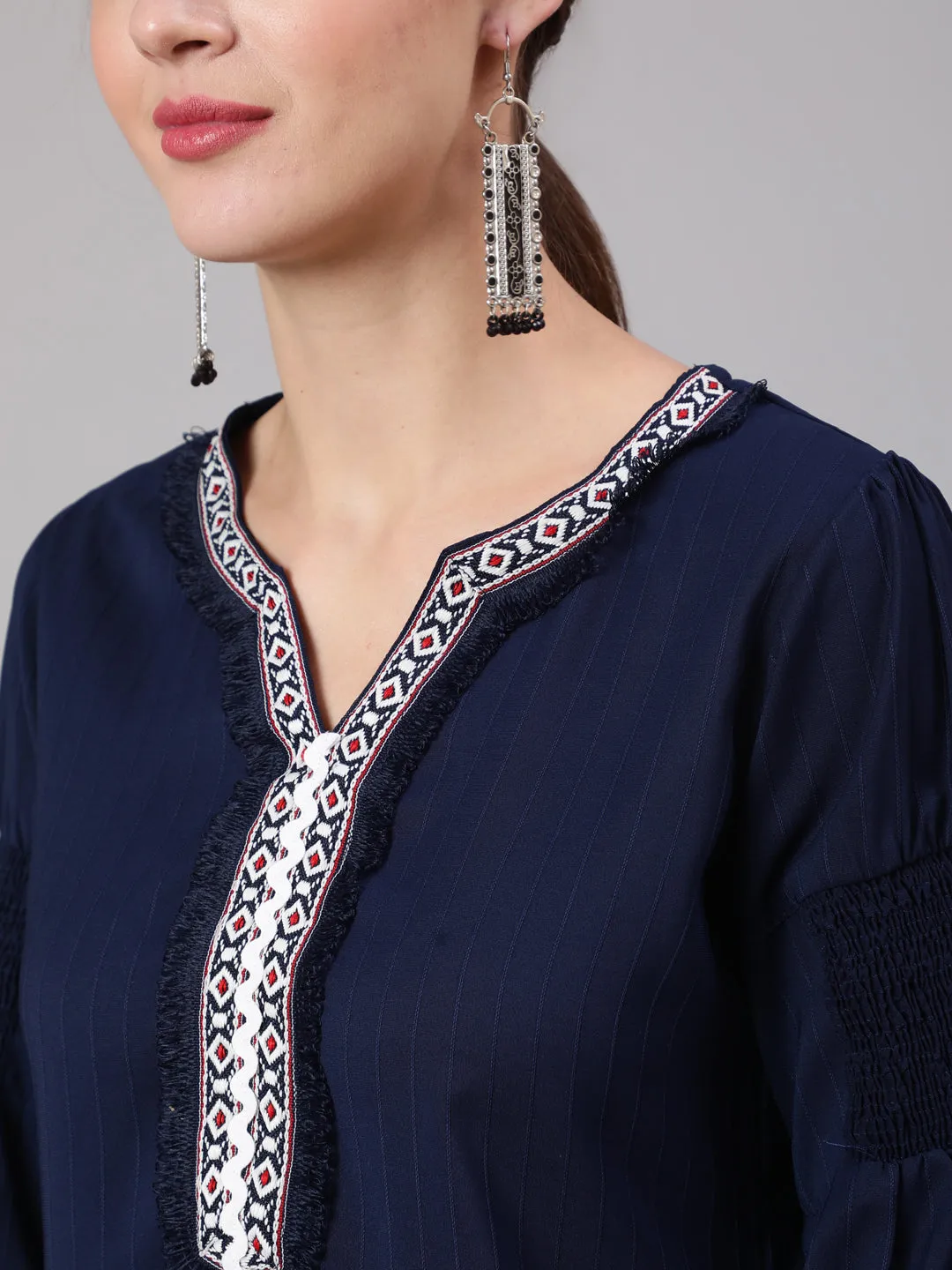 A Blue Silk Blend Lace Embellished Top With Smocked Sleeves With Wide-Leg White Pants
